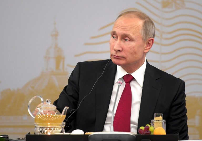 Even though Putin condemned the NSA's spy operation, he told Stone that Snowden shouldn't have leaked the documents they way he did. (Alexei Druzhinin/Sputnik, Kremlin Pool Photo via AP)