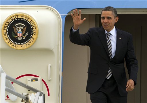President Barack Obama arrives at Los Angeles International Airport in Los Angeles, Wednesday, Feb. 15, 2012. (AP Photo/Damian Dovarganes)