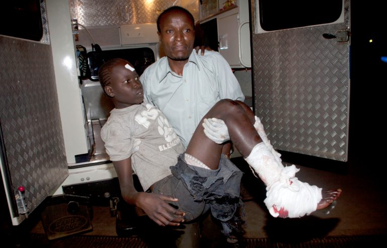 An injured child arrives in an ambulance at Kenyatta National Hospital, Nairobi, Sunday May 4, 2014. Two improvised explosive devices went off on buses along one of busiest highways in the Kenyan capital, Nairobi killing one person and wounding several others, police said Sunday, as the East African nation struggles to crackdown on a recent wave of terrorist attacks. (AP Photo/Sayyid Azim)