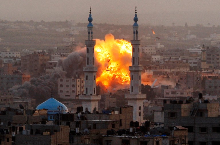   FILE - In this Nov. 17, 2012 file photo, smoke rises during an explosion from an Israeli strike in Gaza City. Israel bombarded the Hamas-ruled Gaza Strip with nearly 200 airstrikes widening a blistering assault on Gaza rocket operations by militants to include the prime minister's headquarters, a police compound and a vast network of smuggling tunnels. 2012 was a year of storms, of raging winds and rising waters, but also broader turbulence that strained our moorings. Old enmities and grievances resurfaced in the Middle East, clouding the legacy of the 2011 Arab spring. And Israeli and Palestinian civilians suffered through another escalation of the conflict in Gaza. (AP Photo/Hatem Moussa, File)  