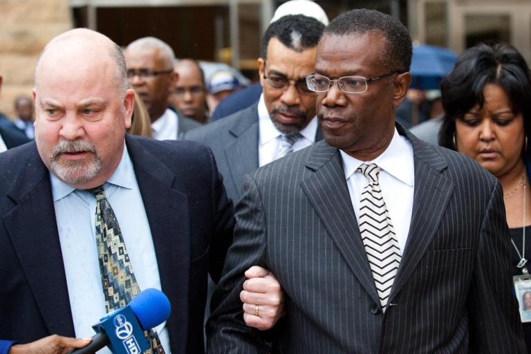 Jack Johnson walks out of U.S. District Court with his lawyer Jeff Harding in Greenbelt, Md., Tuesday, Dec 6, 2011.