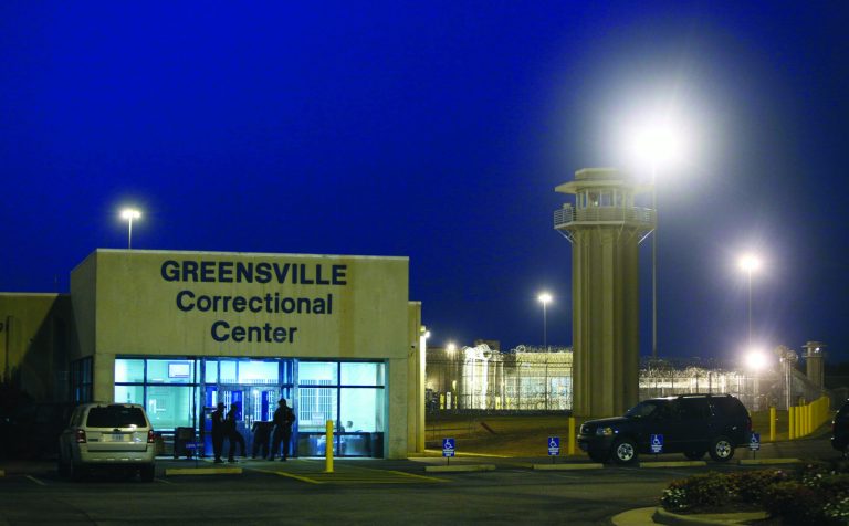 FILE In this Thursday Sept. 23, 2010 file photo prison guards mill outside the entrance to the Greensville Correctional Center in Jarratt, Va. Robert Gleason Jr. is scheduled to be executed at 9 p.m., Wednesday, Jan. 16, 2013 at the prison. (AP Photo/Steve Helber)