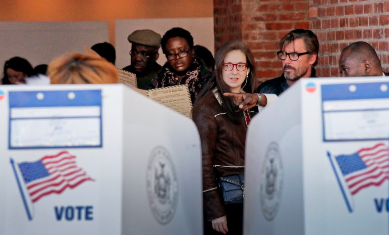 Voters are directed to empty booths to mark their ballots at the Brooklyn Museum polling site, Tuesday Nov. 8, 2016, in Brooklyn, N.Y. (AP Photo/Bebeto Matthews)