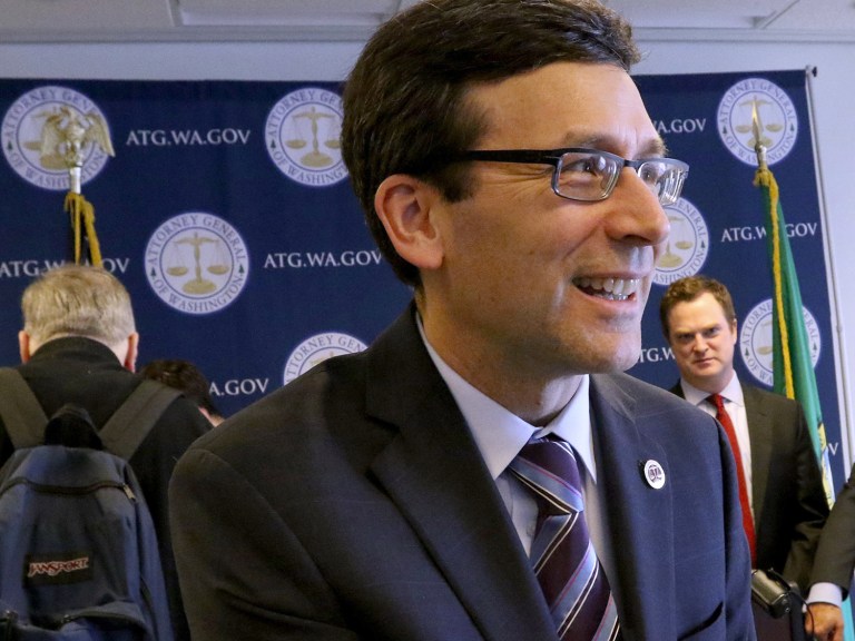 Washington State Attorney Gen. Bob Ferguson looks pleased with the state Supreme Court's unanimous decision in the case against Arlene's Flowers. He argued the case before the court. (Alan Berner/The Seattle Times via AP)