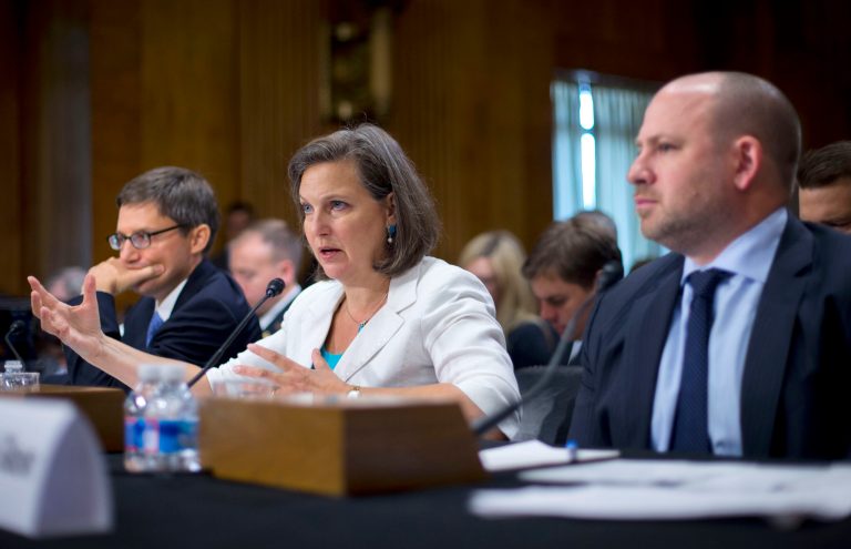 Assistant Secretary of State Victoria Nuland, center, is flanked by Assistant Secretary of Defense Derek Chollet, left, and Assistant Treasury Secretary Daniel Glaser, right, as she testifies on Capitol Hill in Washington, Wednesday, July 9, 2014, before the Senate Foreign Relations Committee hearing to examine Russia and developments in Ukraine,  (AP Photo/Pablo Martinez Monsivais)