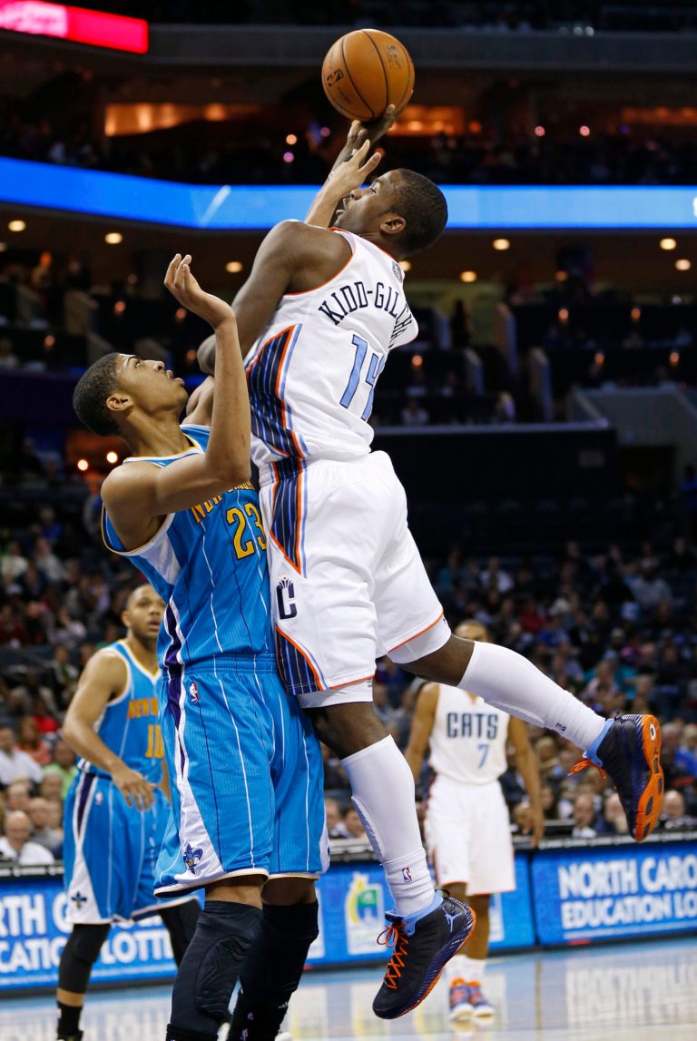   Charlotte Bobcats' Michael Kidd-Gilchrist (14) shoots over New Orleans Hornets' Anthony Davis (23) during the first half of an NBA basketball game in Charlotte, N.C., Saturday, Dec. 29, 2012. (AP Photo/Chuck Burton)  