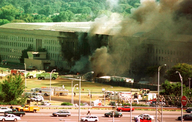 Vehicles are shown traveling on Interstate 395, leaving Washington, in front of the Pentagon, following an explosion. (AP Photo/Tom Horan)