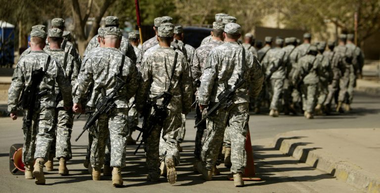 U.S. army soliders from 4/42 Field Artillery Battalion march during a transfer ceremony in the heavily fortified Green Zone area March 4, 2009 in Baghdad, Iraq. (Photo by Wathiq Khuzaie/Getty images)