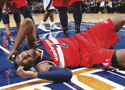 Kevin C. Cox/Getty Images
Wizards guard John Wall is averaging nearly a turnover more through three games than he did in his rookie season a year ago.