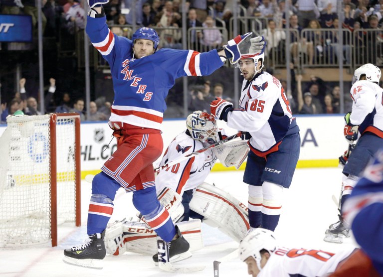 Kathy Willens/AP
Rangers winger Ryane Clowe celebrates a goal scored by Carl Hagelin in New York's Game 4 victory over the Capitals on Wednesday.