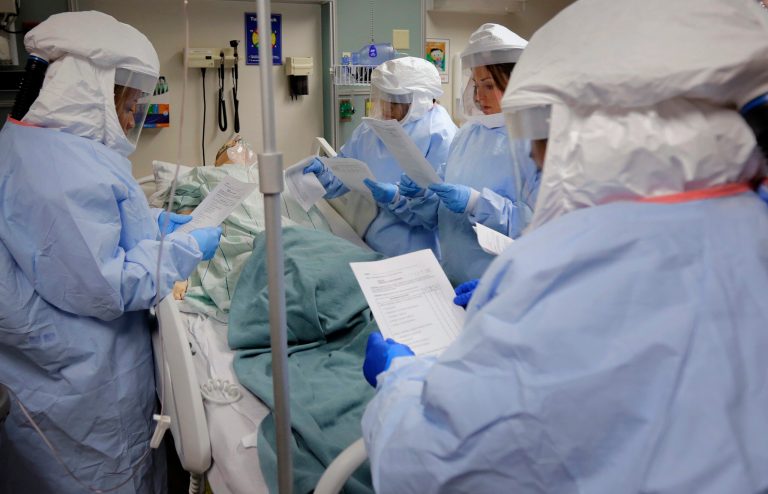 Members of the Department of Defense's Ebola Military Medical Support Team use check lists during training at San Antonio Military Medical Center in San Antonio. (AP Photo/Eric Gay)
