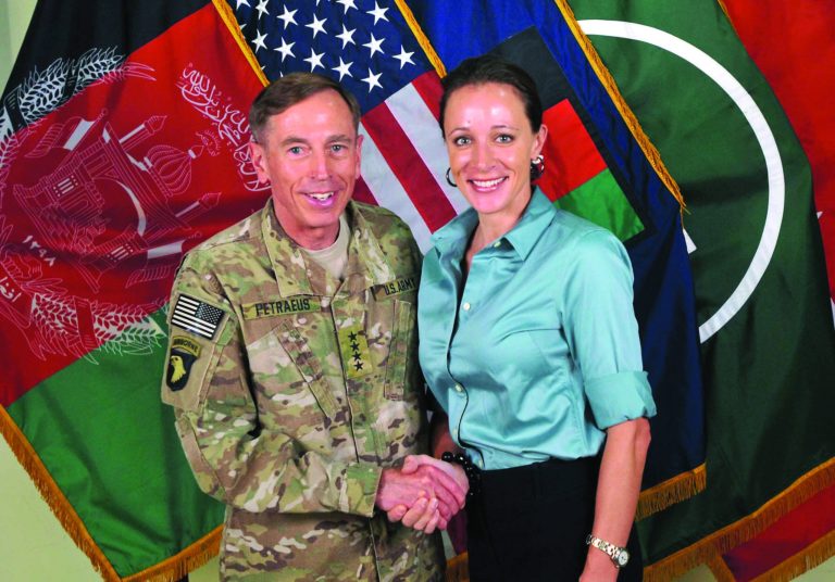 FILE -- This July 13, 2011, photo made available on the International Security Assistance Force's Flickr website shows the former Commander of International Security Assistance Force and U.S. Forces-Afghanistan Gen. Davis Petraeus, left, shaking hands with Paula Broadwell, co-author of 