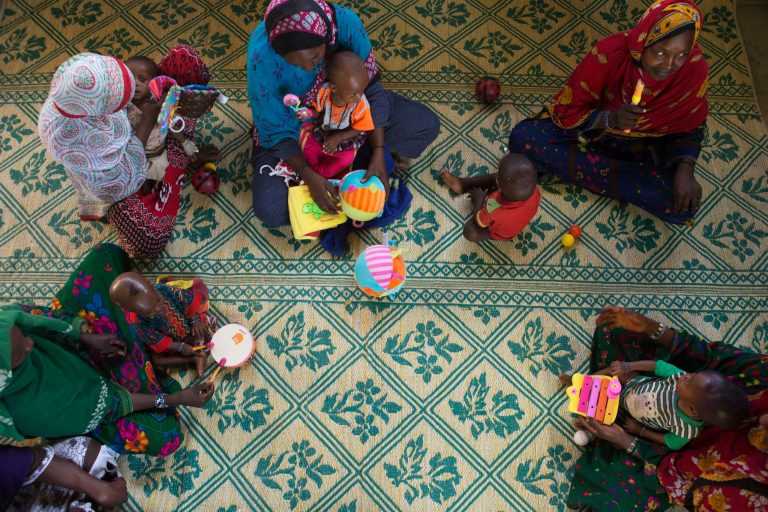   ADVANCE FOR SATURDAY DEC 22, 2012 In this Nov. 5, 2012 photo, mothers try to engage their malnourished children in playtime as part of the treatment program at a nutritional health clinic run by Action Against Hunger with the support of UNICEF, in Moussoro, Chad. In this Sahel nation, childhood malnutrition and related mortality persist at alarming rates, despite the fact that many affected families live within a day's journey of internationally-funded nutrition clinics. One reason is that families, bound by local custom, choose instead to seek traditional treatments, treatments which can lead to the very infections that kill their undernourished children.(AP Photo/Rebecca Blackwell)  