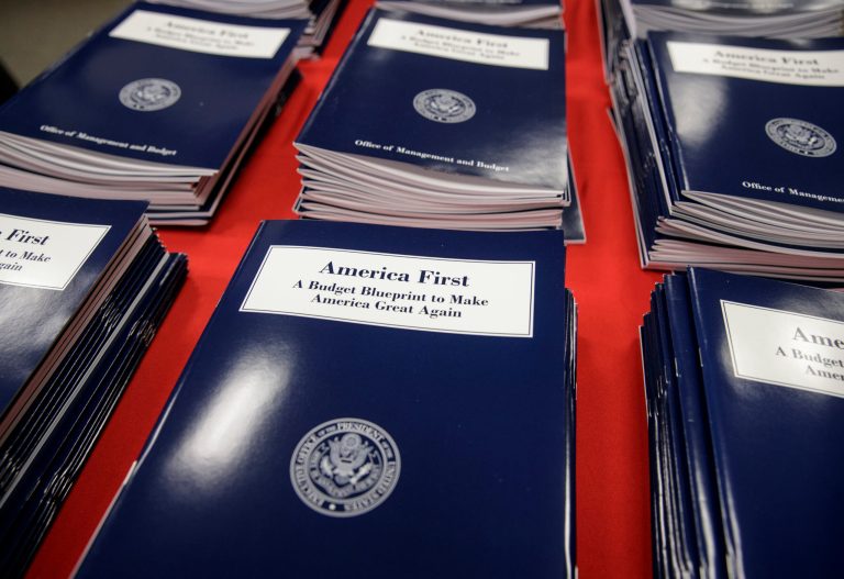 Copies of President Trump's first budget are displayed at the Government Printing Office in Washington on March 16. Trump unveiled a $1.15 trillion budget on Thursday, a far-reaching overhaul of federal government spending that slashes many domestic programs to finance a significant increase in the military and make a down payment on a U.S.-Mexico border wall. (AP Photo/J. Scott Applewhite)
