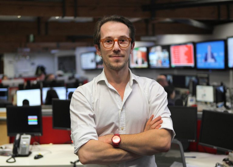 Fisnik Abrashi at Associated Press' London office, Thursday, Feb. 6, 2014. Abrashi, an AP correspondent and editor who covered wars and their aftermath on three continents, has been appointed all-formats news director for central and eastern Europe, responsible for leading video, photo and text coverage in a region stretching from the Balkans to Poland, it was announced Friday Feb. 7 2014. (AP Photo/Lefteris Pitarakis)