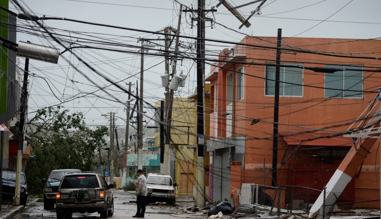 Power lines are down after the impact of Hurricane Maria in Puerto Rico. The mayor of Puerto Rico's capital thinks the island will likely be without power for as long as six months. (AP Photo/Carlos Giusti)