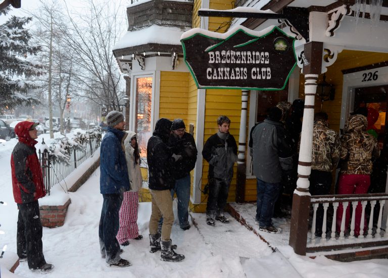 A line waits outside the Cannabis Club  on Main Street  in downtown Breckenridge, Colo., for an 8 a.m. opening of the store on Jan. 1.  (AP/Denver Post)