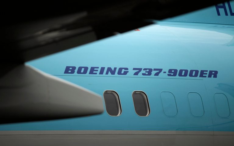 A Boeing Co. 737-900ER aircraft sits on display on the first day of the Farnborough International Air Show in Farnborough, U.K., on Monday, July 9, 2012. The Farnborough International Air Show runs from July 9-15. Photographer: Matthew Lloyd/Bloomberg