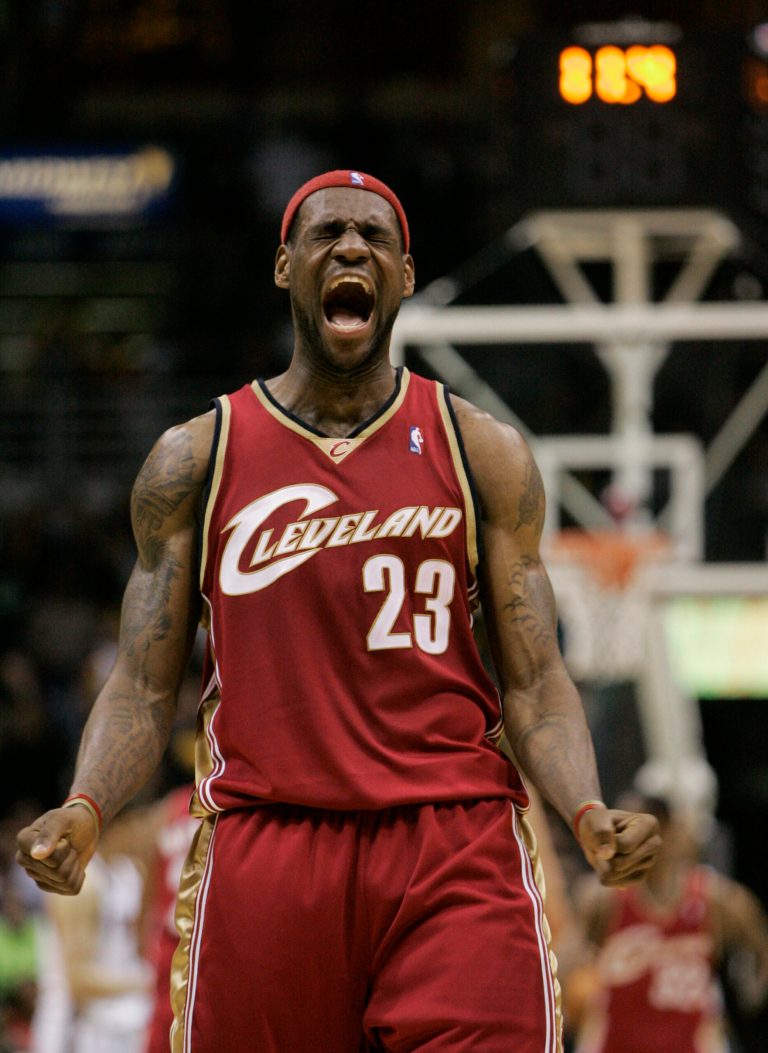 FILE - In this March 10, 2007, file photo, Cleveland Cavaliers forward LeBron James reacts to a shot made by teammate Anderson Varejao  during the final seconds of the fourth quarter of an NBA basketball game in Milwaukee. James told Sports Illustrated on Friday, July 11, 2014, he is leaving the Miami Heat to go back to the Cleveland Cavaliers. (AP Photo/Morry Gash, File)