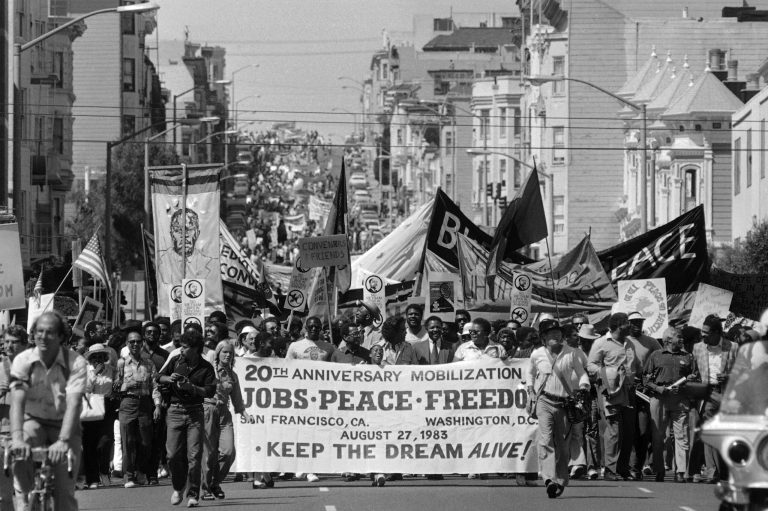 Thousands of people march in downtown San Francisco from Golden Gate Park to City Hall on August 27, 1983 to commemorate the 20th anniversary of the Rev. Martin Luther King's March on Washington. (AP Photo/Paul Sakuma)
