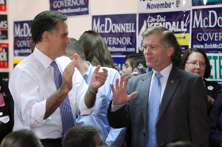 In this Oct. 26, 2011 file photo, Republican presidential candidate, former Massachusetts Gov. Mitt Romney, left, and Virginia Gov. Bob McDonnell talk at the Fairfax County Republican Committee headquarters in Fairfax.