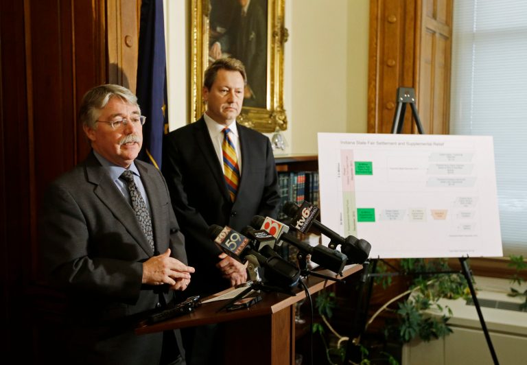   Indiana Attorney General Greg Zoeller, left, speaks as Bill Baten listens during a news conference at the Statehouse Thursday, Dec. 20, 2012, in Indianapolis. Zoeller announced the details of the distribution of the $6 million in supplemental relief to victims of the Indiana State Fair stage collapse. (AP Photo/Darron Cummings)  