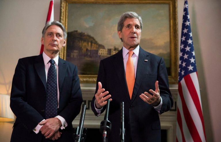 Britain's Foreign Secretary Philip Hammond and U.S. Secretary of State John Kerry, right, deliver a statement at a press conference in London, Saturday Feb, 21, 2015. (AP Phto/Neil Hall/Pool)