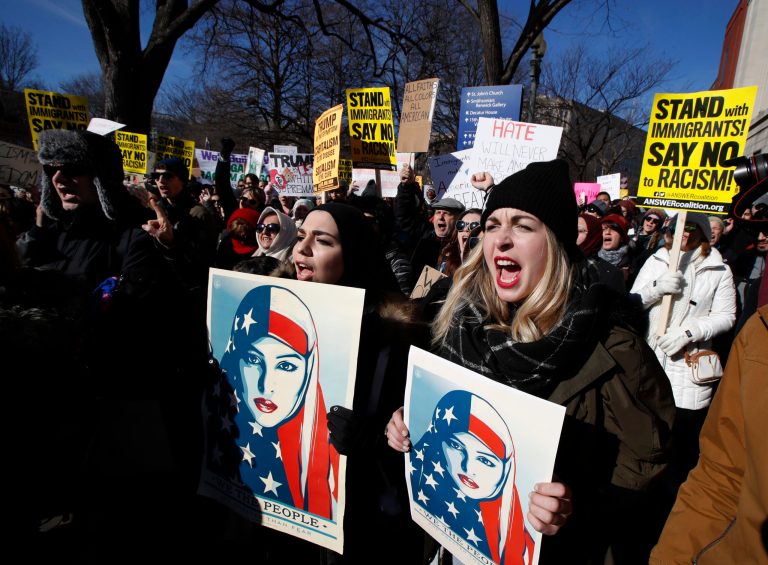Martha Obermiller of Denver, right, chants during a rally protesting the immigration policies of President Donald Trump, near the White House in Washington, Saturday, Feb. 4, 2017. (AP Photo/Manuel Balce Ceneta)