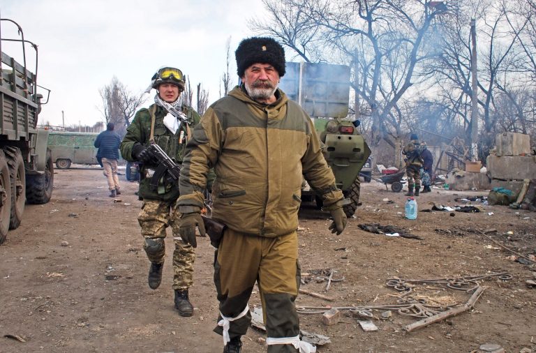 Cossack commander Nikolai Kozitsyn, foreground, a Russian national known to his fellow rebel fighters by the nom de guerre 