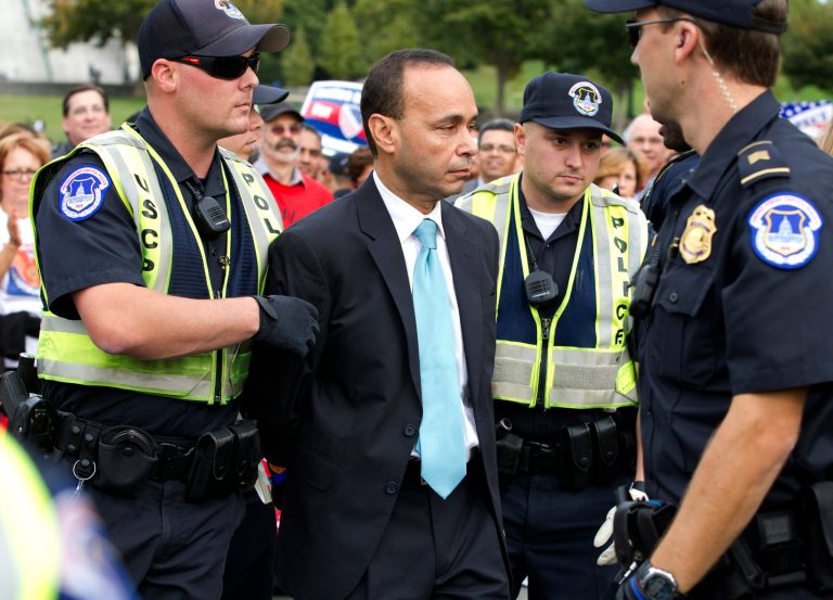 Rep. Luis Gutierrez, D-Ill., is arrested by U.S. Capitol Police officers on Capitol Hill during a immigration rally in Washington, on Tuesday, Oct. 8, 2013. ( AP Photo/Jose Luis Magana)