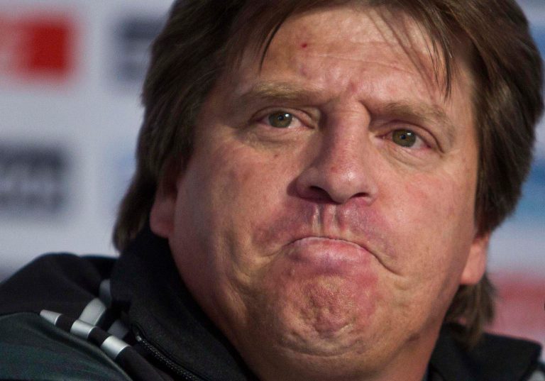 File - In this Dec. 6, 2013, file photo, Mexico's head coach Miguel Herrera listens to a question during a press conference at the national team's training center in Mexico City, after the final draw in Brazil for the 2014 World Cup.  Herrera, who said last May 2014, that he expects his players to refrain from any horizontal samba during their stay in Brazil, where the monthlong tournament opens next week. (AP Photo/Christian Palma, File)