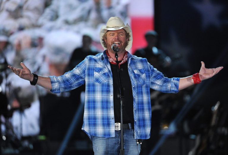 FILE - In this April 7, 2014 file photo shows Toby Keith performs at ACM Presents an All-Star Salute to the Troops  in Las Vegas. The New York location of country music star Toby Keith's chain of restaurants owes more than a quarter-million dollars in sales taxes to the state. A tax warrant filed by the state earlier this month seeks $107,000 owed by  Keith's I Love this Bar & Grill at the Destiny USA shopping mall in Syracuse. Keith's Syracuse bar, which opened last year, also owes more than $145,000 in sales taxes from earlier in 2013. The musician's chain of restaurants, named for the title of one of his hit songs, features guitar-shaped bars, beer in mason jars and traditional southern food. (Photo by Chris Pizzello/Invision/AP)