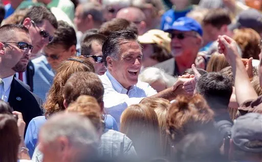 Republican presidential candidate Mitt Romney smiles as he shakes hands with the crowd gathered at Carter Machinery Company in Salem, Va. on Tuesday, June 26, 2012. (AP Photo/The Roanoke Times, Kyle Green) )