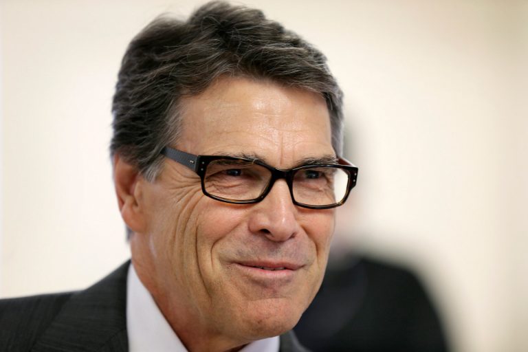 Texas Gov. Rick Perry will join Kansas Gov. Sam Brownback next week on the campaign trail, lending a hand to one of the most troubled Republican governors. (AP Photo/Charlie Neibergall)