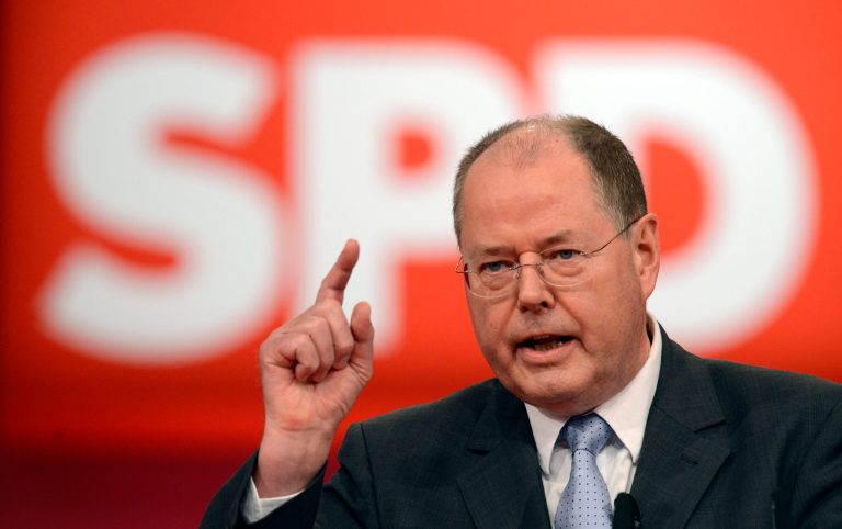   Peer Steinbrueck of the SPD , German Chancellor Angela Merkel's challenger for the next elections, delivers a speech during an extraordinary party convention of the German Social Democrats, SPD, in Hannover, northern Germany, Sunday, Dec. 9, 2012. The center-left Social Democrats held a special party convention to elect former Finance Minister Steinbrueck officially as their candidate to take on Merkel when Germans elect a new Parliament next fall. (AP Photo/dapd, Clemens Bilan)  