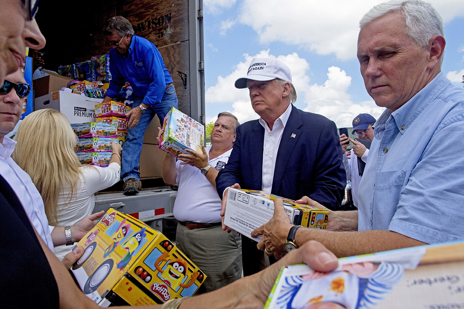 Clinton tweets sympathies as Trump meets flood victims