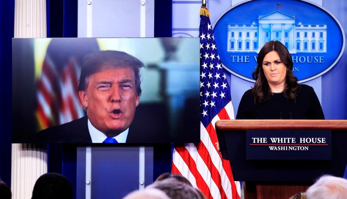 "It's disgraceful and laughable," Sanders said of criticism aimed at Trump's mental state. "If he was unfit, he probably wouldn't be sitting there," she added. (AP Photo/Manuel Balce Ceneta)