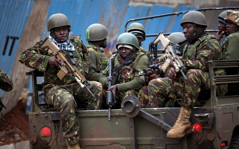 Sunday, Sept. 22, 2013: Nairobi, Kenya_ Trucks of soldiers from the Kenya Defense Forces arrive after dawn outside the Westgate Mall. Kenyan authorities said Islamic extremist attackers remain inside the upscale Kenyan shopping mall, holding an unknown number of hostages, after killing and injuring scores of people in the attack. (AP Photo/Ben Curtis)