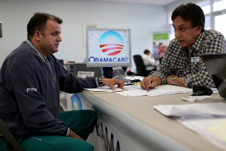 A person signs up for the Affordable Care Act.Â A new report said it identified weaknesses in the federal marketplace's procedures for resolving inconsistencies.Â (Joe Raedle/Getty Images)