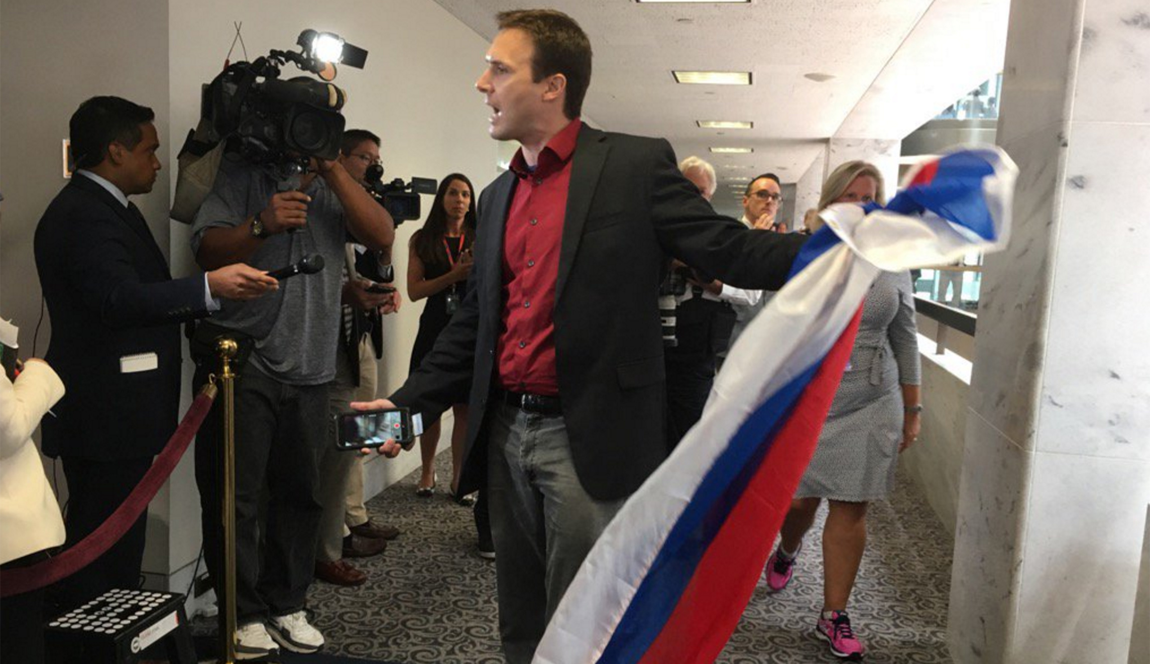 Protester tried to hand Jared Kushner a Russian flag after his Senate testimony