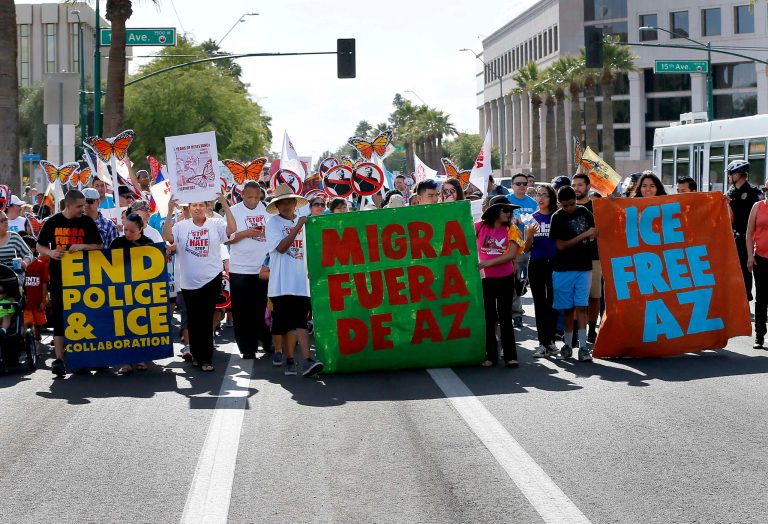 Protesters in Phoenix seek removal of ICE agents from county jails. (AP Photo/Matt York)