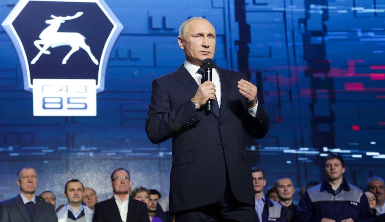 Russian President Vladimir Putin speaks at a meeting with workers of the GAZ factory in Nizny Novgorod, Russia, Wednesday, Dec. 6, 2017. Putin says he will seek re-election in next March's election. (Mikhail Klimentyev, Sputnik, Kremlin Pool Photo via AP)