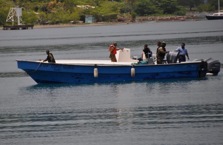 Jamaican Defence Force members return to Port Antonio Marina in Portland, Jamaica, Saturday, Sept. 6, 2014, after a fruitless search for a plane that crashed into the ocean a day earlier. Rescue crews searching off Jamaica's coast on Saturday said they could no longer see debris spotted earlier, stymieing efforts to solve the mystery surrounding a small plane carrying a prominent upstate New York couple that went on a ghostly 1,700-mile journey after the pilot was apparently incapacitated. Jamaican officials said that possible wreckage from the single-engine turboprop Socata TBM700 was sighted Friday evening by a military aircraft flying off the island's northeast coast, drifting roughly 24 miles off the coastal town of Port Antonio. (AP Photo/Everard Owen)