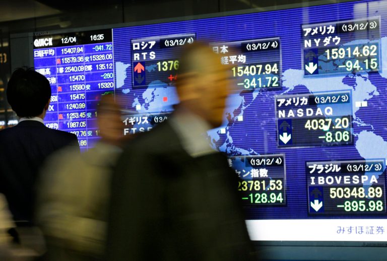 Financial markets were sluggish Wednesday as an apparent budget deal in the U.S. Congress failed to divert attention from investors' primary focus â will the Federal Reserve reduce its monthly stimulus next week? (AP Photo/Shizuo Kambayashi)