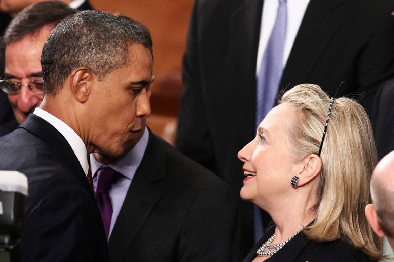 President Barack Obama greets then-Secretary of State Hillary Clinton at his State of the Union address on January 24, 2012 in Washington. (Photo by Win McNamee/Getty images)