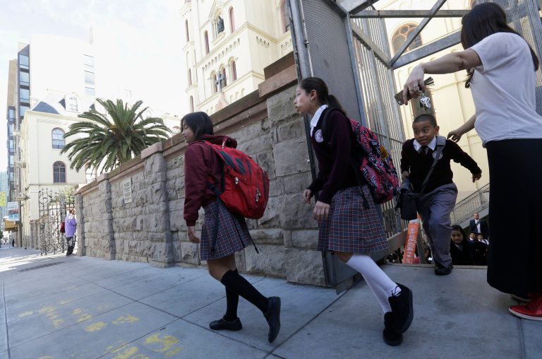 A school is urging everyone, including boys, to sit down while they urinate. (AP Photo/Jeff Chiu)