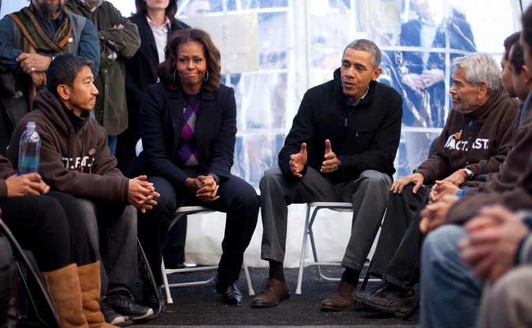 President Obama and first lady Michelle Obama visit with individuals who are taking part in Fast for Families on behalf of immigration reform on the National Mall on Nov. 29. The rollout of Obamacare may have done irreparable damage to the prospects for any immigration reform proposal. (AP Photo/Pablo Martinez Monsivais)