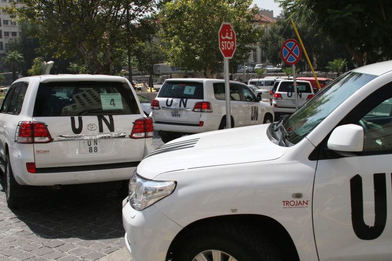 FILE -- In this August 26, 2013, file Photo, a U.N. team, that is scheduled to investigate an alleged chemical attack that killed hundreds last week in a Damascus suburb, leaves their hotel in a convoy, in Damascus, Syria. In a  statement issued Tuesday, May 27, 2014, by the chemical weapons watchdog that is overseeing the dismantling of Syria's chemical weapons program, said a convoy of its inspectors has come under attack, but all are safe.  The Organization for the Prohibition of Chemical Weapons said that the inspectors had been traveling to the site of an alleged chlorine gas attack site when they were attacked. (AP Photo, File)