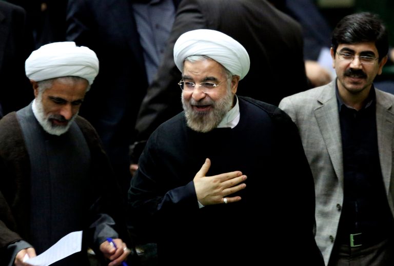 Iranian President Hassan Rouhani smiles as he leaves a parliament session in Tehran on Sunday. Secretary of State John Kerry pushed a deal that would offer limited, temporary sanctions relief in exchange for Iran freezing elements of its nuclear program, but it fell through.ÃÂ (AP Photo/Ebrahim Noroozi)