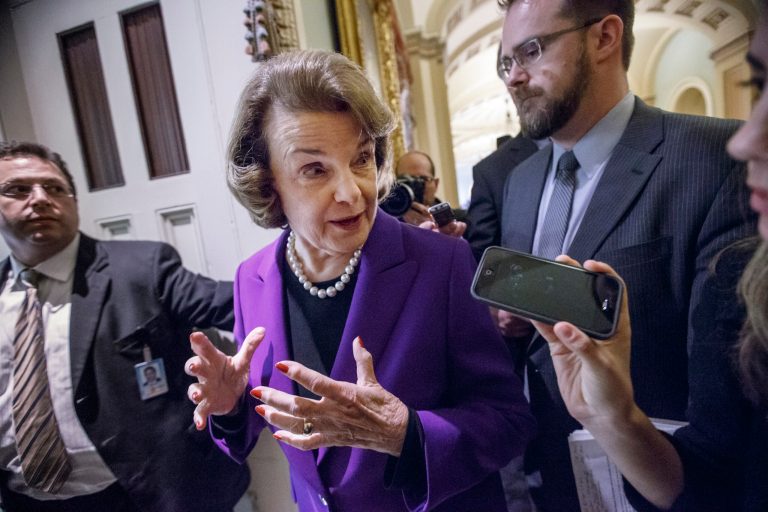 Senate Intelligence Committee Chair Sen. Dianne Feinstein, D-Calif. speaks to reporters on Capitol Hill in Washington, Tuesday, Dec. 9, 2014, as she leaves the Senate chamber after releasing a report on the CIA's harsh interrogation techniques at secret overseas facilities after the 9/11 terror attacks. Feinstein branded the findings a 